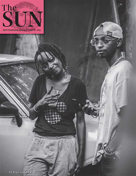 September 2024 cover of The Sun. Eunice, a vocalist, and Martking, a rapper, lean against a car at an outdoor gathering during the pandemic in Nairobi, Kenya.