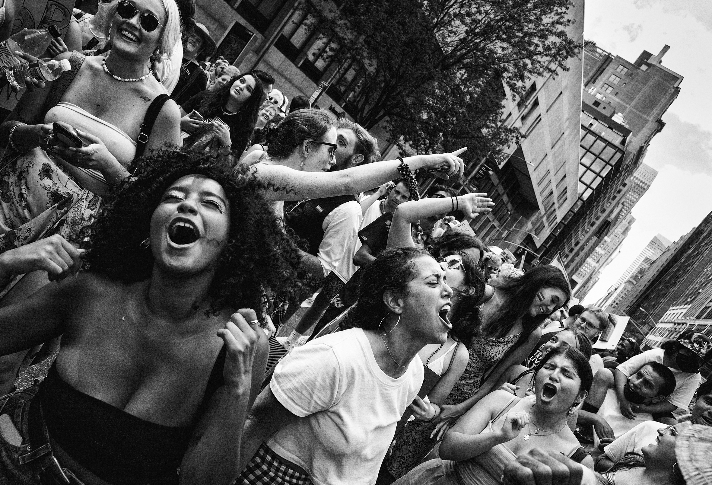 Crowd of people on the street in New York City at a diversity celebration.