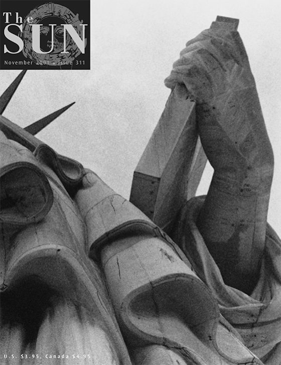 November 2001 cover of The Sun. Released after the terrorist attacks of 9/11, the cover features a black logo and its photo wraps around to the back, turning a portrait of the Statue of Liberty into a landscape.