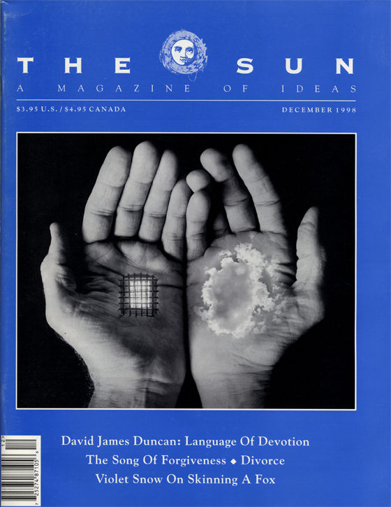 December 1998 cover of The Sun. A photomontage of a pair of open palms: one holds a cloud while the other holds a window with bars over it.