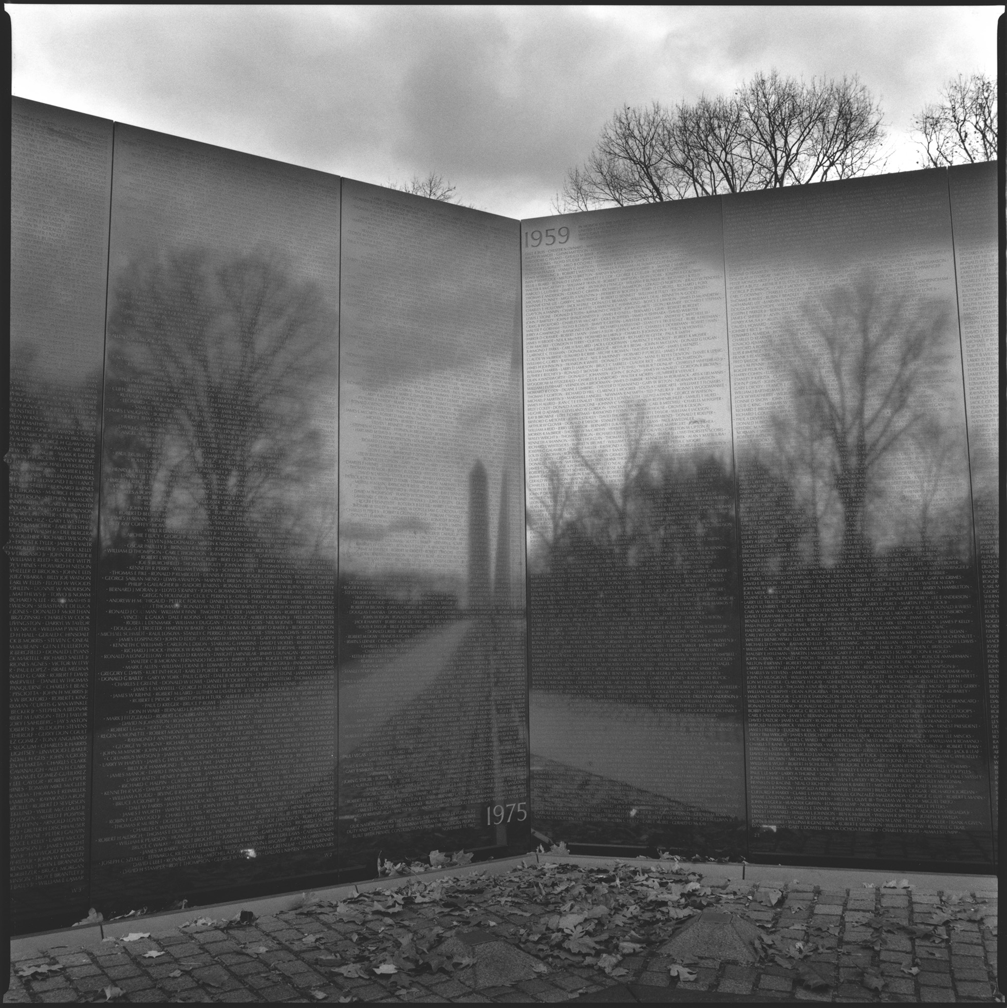 Close-up of a portion of the Vietnam Veterans Memorial Wall on a bleak winter day.