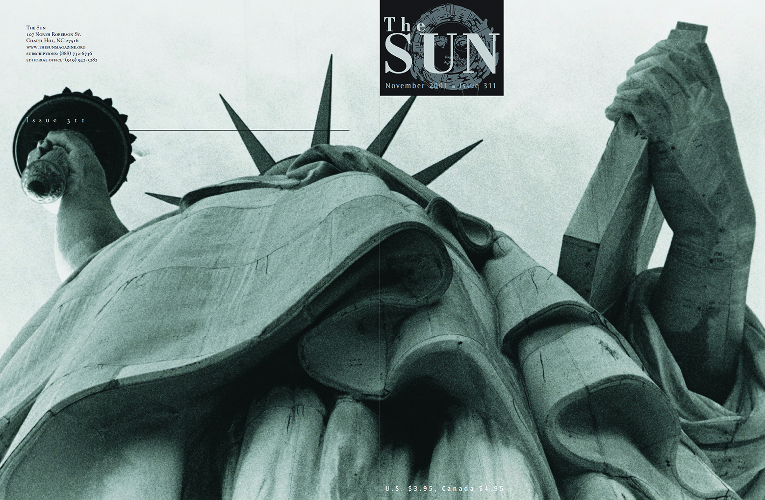 November 2001 cover of The Sun. Released after the terrorist attacks of 9/11, the cover features a black logo and its photo wraps around to the back, turning a portrait of the Statue of Liberty into a landscape.