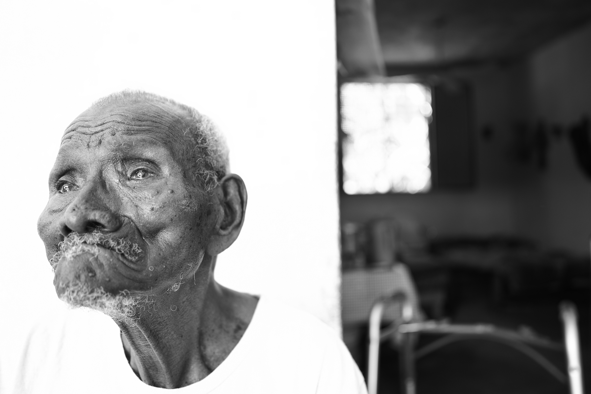 A centenarian stands outside his home in Collantes, Oaxaca in January 2022.